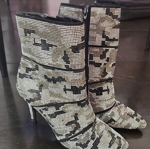 Sleek Black and Silver Heeled Boots with Tactical Glamour